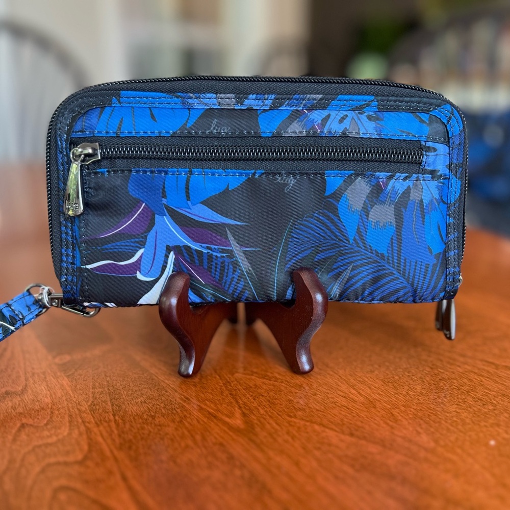 Lug women’s Blue and Black Tropical Print Wallet with Zippered Closure